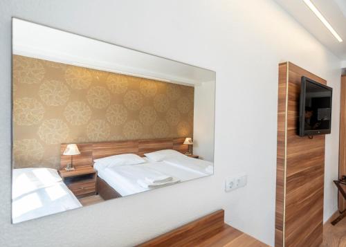 Habitación Triple del hotel Enziana Wien. Foto 3
