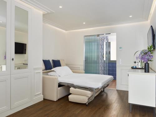 Junior Suite Deluxe Familiar del hotel H10 Universitat. Foto 9