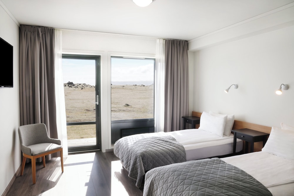 Habitación superior con 1 cama doble o 2 individuales del hotel Fosshotel Núpar. Foto 1
