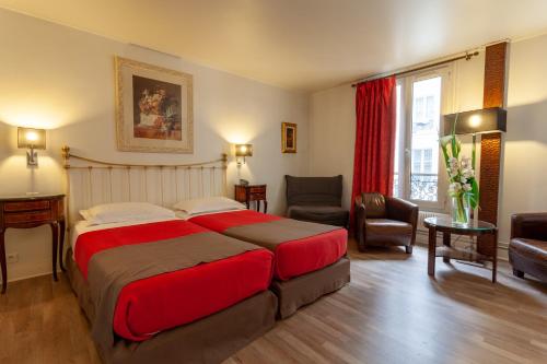 Habitación Triple Deluxe del hotel Atlantis Saint Germain Des Prés. Foto 1