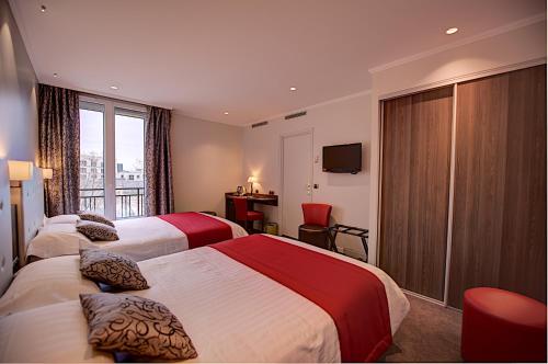 Habitación cuádruple del hotel Du Midi Paris Montparnasse. Foto 5