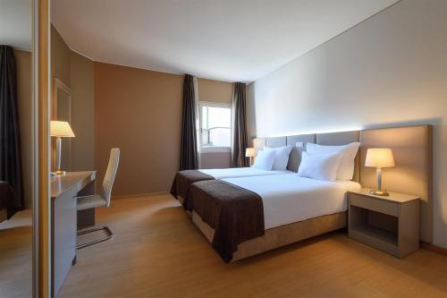 Habitación Doble Deluxe para no fumadores - 2 camas individuales del hotel Tryp By Wyndham Porto Centro. Foto 1