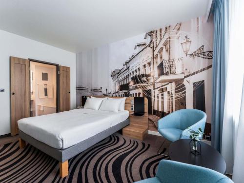 Habitación Superior - 1 cama grande del hotel Novotel Vilnius Centre. Foto 1