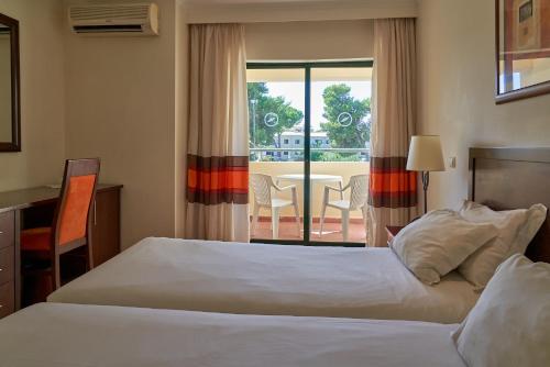 Habitación Familiar del hotel The Navigator- Palm Oasis Alvor. Foto 1