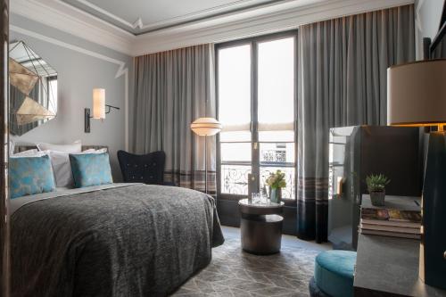 Dos habitaciones dobles adyacentes del hotel Nolinski Paris - Evok Collection. Foto 1