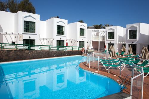 Apartamento de 1 dormitorio con vistas a la piscina del hotel Tao Caleta Playa. Foto 1