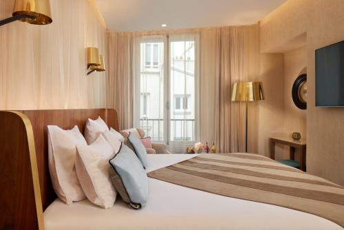 Habitación Doble Deluxe del hotel Maison Albar - Le Pont-neuf. Foto 1