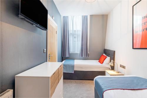 Habitación Doble Deluxe - 2 camas del hotel OYO Apollo Hotel Bayswater