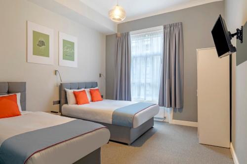 Habitación Triple Deluxe del hotel OYO Apollo Hotel Bayswater
