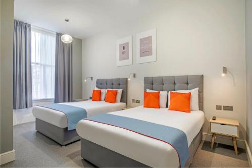 Habitación Cuádruple Superior del hotel OYO Apollo Hotel Bayswater. Foto 1