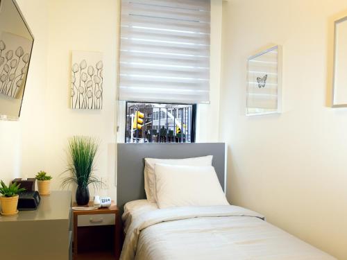 Habitación Individual con baño del hotel Midtown West. Foto 9