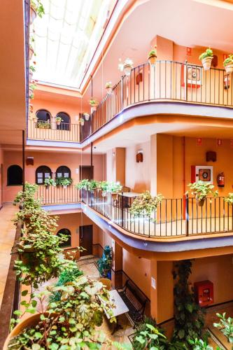 Habitación Doble con cama supletoria del hotel Patio De La Alameda. Foto 5