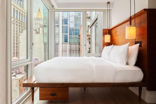 Habitación Essential - Cama extragrande del hotel Arlo Nomad. Foto 4