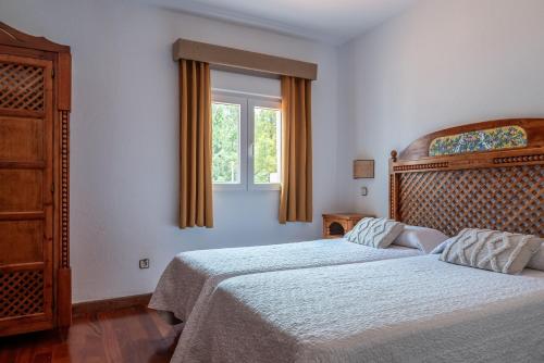 Habitación Doble - 2 camas del hotel El Refugio. Foto 9