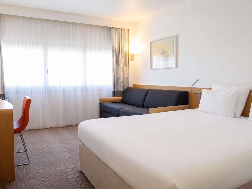 Habitación Clásica - 1 cama doble y 1 sofá - cama para 1 persona del hotel Novotel Nantes Centre Gare. Foto 1
