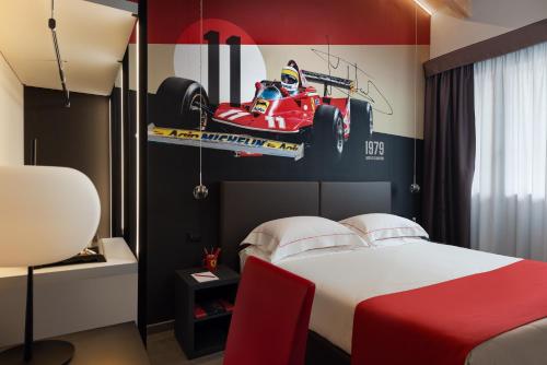 Habitación Triple Deluxe del hotel Maranello Village. Foto 1
