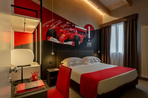Habitación Triple Deluxe del hotel Maranello Village. Foto 2
