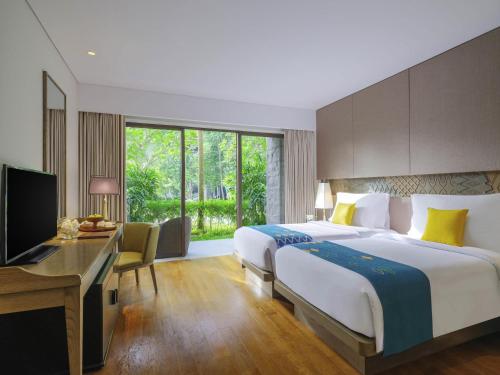 Classic Twin Room with Free Daily Chocolate Hours and Daily Resort Activities del hotel Movenpick Resort and Spa Jimbaran Bali - Chse Certified