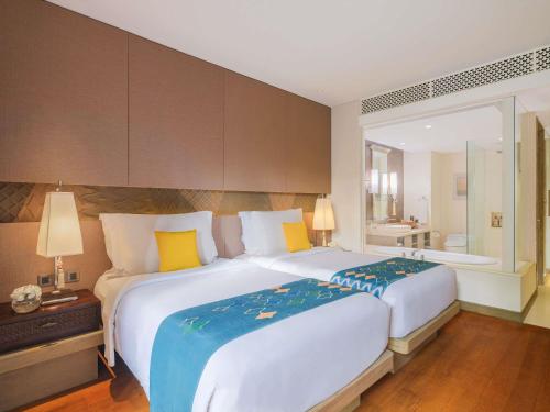 Classic Twin Room with Free Daily Chocolate Hours and Daily Resort Activities del hotel Movenpick Resort and Spa Jimbaran Bali - Chse Certified. Foto 4