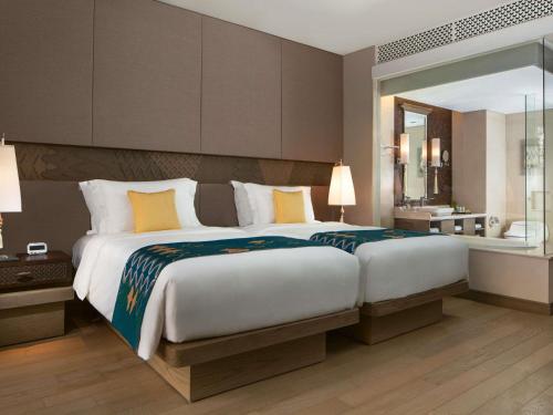 Classic Twin Room with Pool View with Free Daily Chocolate Hours and Daily Resort Activities del hotel Movenpick Resort and Spa Jimbaran Bali - Chse Certified. Foto 3