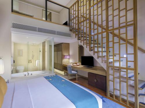 Family Duplex Room with Pool View del hotel Movenpick Resort and Spa Jimbaran Bali - Chse Certified