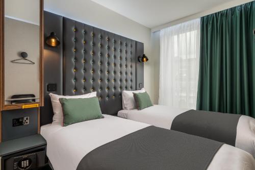 Habitación Doble con 2 camas, acogedora y con vistas del hotel Point A London Shoreditch. Foto 1