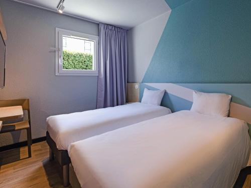 Habitación con 2 camas individuales del hotel ibis Budget La Teste Bassin d'Arcachon