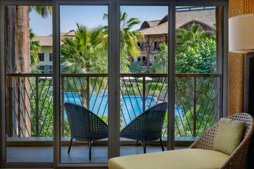 Family Room, Guest room, Pool View, Balcony del hotel Lapita, Dubai Parks and Resorts, Autograph Collection. Foto 1