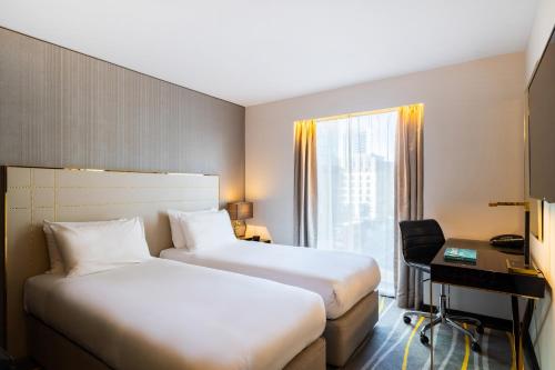Suite con sofá cama - Cama extragrande del hotel Saint London