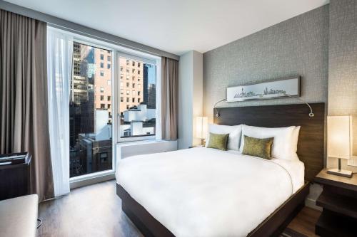 Habitación Queen del hotel The Bernic NYC. Foto 1