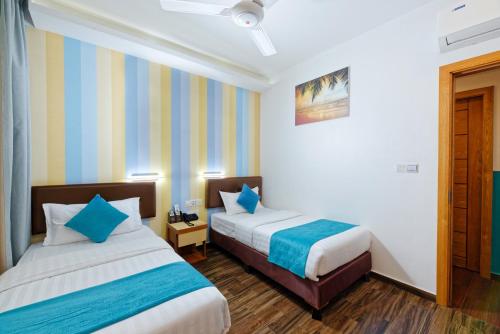 Habitación Doble Deluxe con traslado gratuito de ida y vuelta al aeropuerto y 10% de descuento en alimentos y bebidas - 2 camas individuales del hotel H78 Maldives