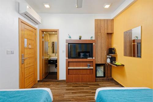 Habitación Doble Deluxe con traslado gratuito de ida y vuelta al aeropuerto y 10% de descuento en alimentos y bebidas - 2 camas individuales del hotel H78 Maldives. Foto 5