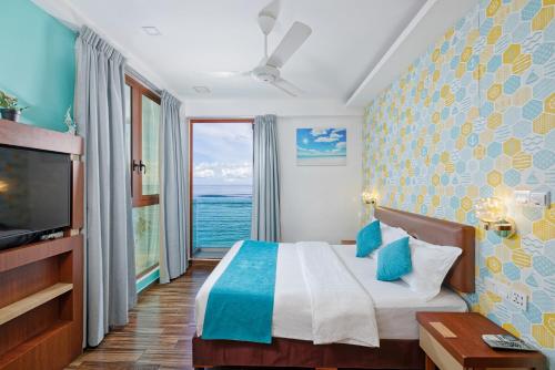 Habitación Doble Deluxe con vistas al mar, traslado gratuito de ida y vuelta al aeropuerto y 10% de descuento en comida y bebida - 1 cama doble del hotel H78 Maldives