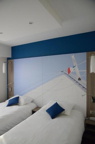 Suite familiar Standard con cama doble y dos camas individuales del hotel Ibis Styles Saint Gilles Croix De Vie