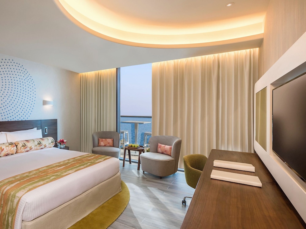 Habitación Deluxe con Balcón, Vista Parcial al Mar de Palmeras del hotel The Retreat Palm Dubai - MGallery by Sofitel. Foto 1