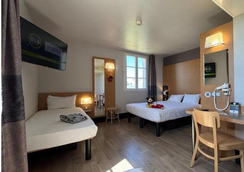 Habitación Triple del hotel B&B près de Disneyland Paris. Foto 3