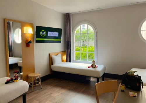 Habitación cuádruple del hotel B&B près de Disneyland Paris. Foto 2