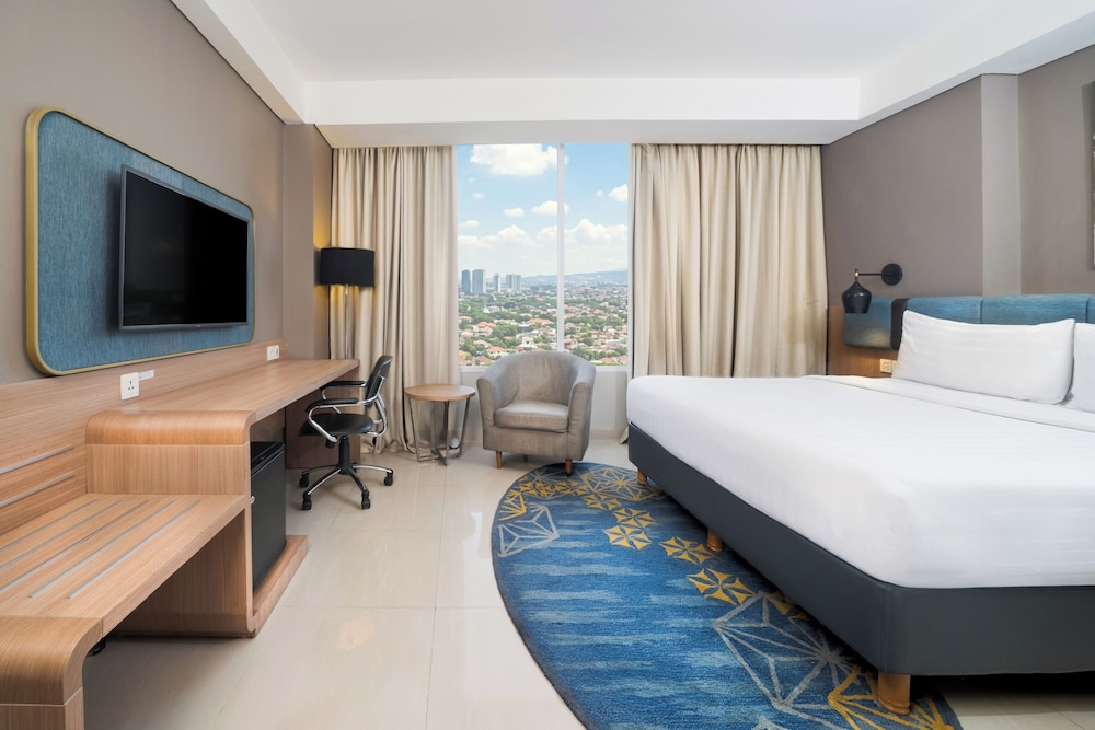 Habitación Deluxe con 1 cama doble del hotel Mercure Bandung Nexa Supratman. Foto 1