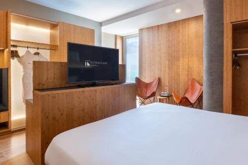 Habitación Deluxe del hotel Eurostars Barcelona Central. Foto 1