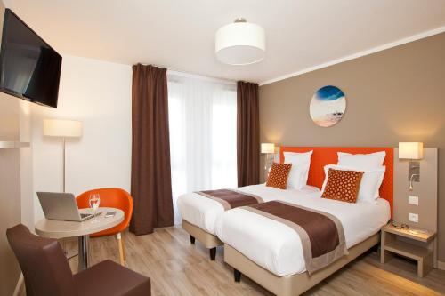 Estudio con 1 cama doble o 2 individuales del hotel Residhome París Rosa Parks. Foto 2