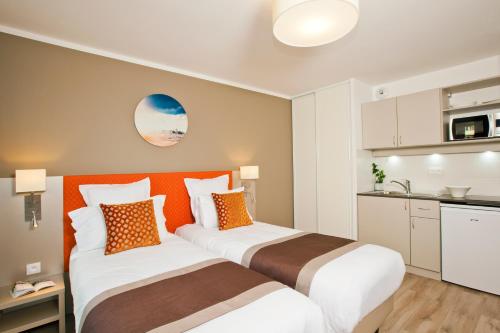 Estudio con 1 cama doble o 2 individuales del hotel Residhome París Rosa Parks. Foto 4