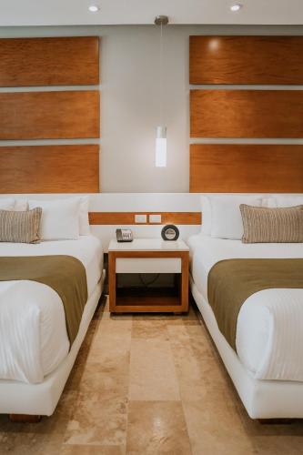 Suite Junior Deluxe - 2 camas grandes del hotel The Reef 28 and Spa - Luxury Adults Only - All Suites - With Optional All Inclusive. Foto 4