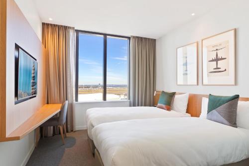 Estudio con 2 camas individuales del hotel Mantra At Sydney Airport. Foto 1