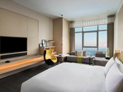 Luxury Room Club Millesime Modern Style (King bed) del hotel Sofitel Foshan. Foto 1