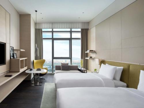 Superior Twin Room Morden Style (Twin bed) del hotel Sofitel Foshan. Foto 1
