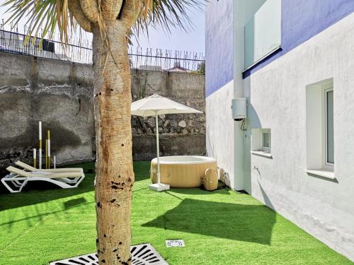 Trabaja y desconecta: Apartamento con bañera de hidromasaje y jardín del hotel The Blue Corner. Foto 5
