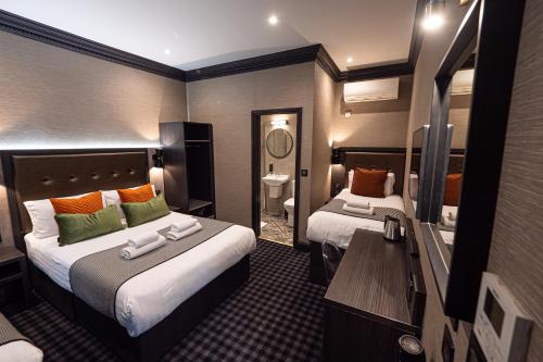 Habitación Doble con cama supletoria del hotel The House Of Toby