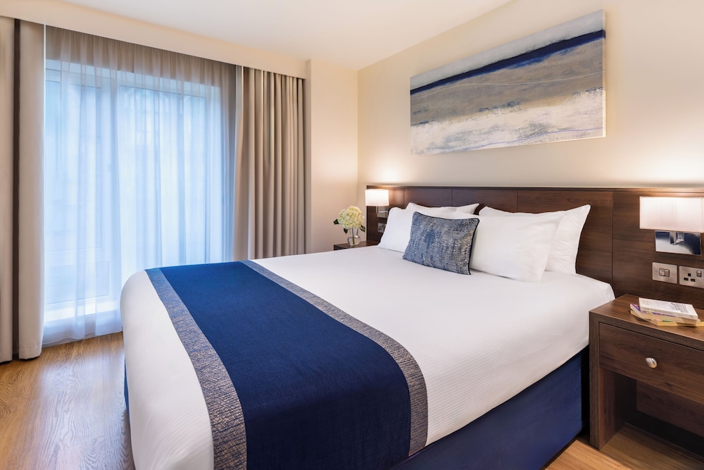 Suite Deluxe, 1 cama de matrimonio con sofá cama del hotel Marlin Waterloo. Foto 1