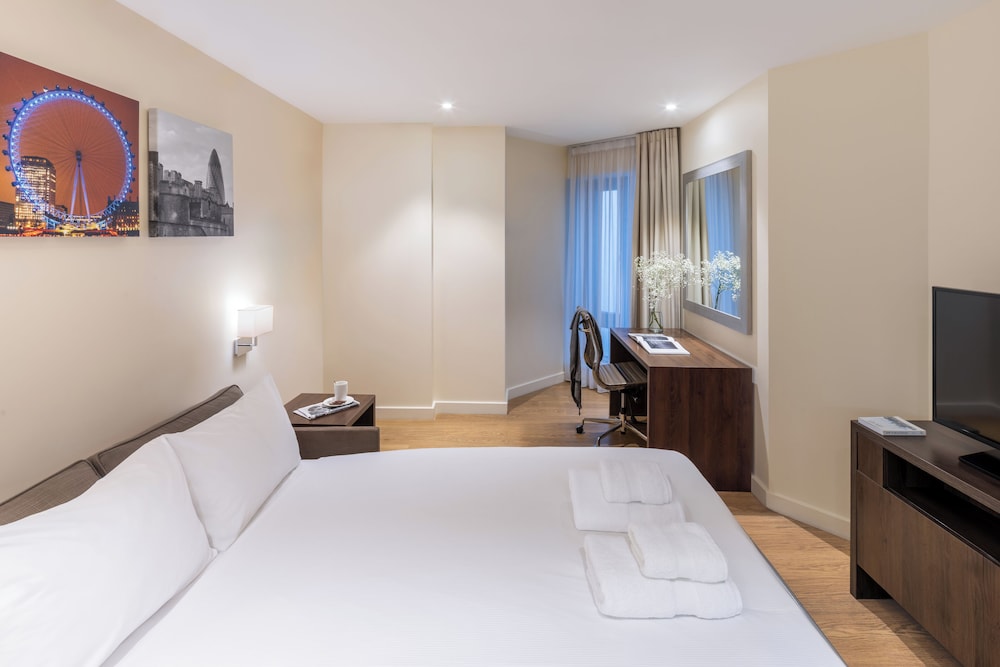 Suite Deluxe, 1 cama de matrimonio con sofá cama del hotel Marlin Waterloo. Foto 2