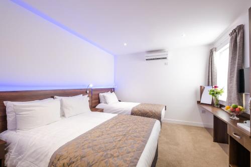 Habitación Triple del hotel Signature London. Foto 6